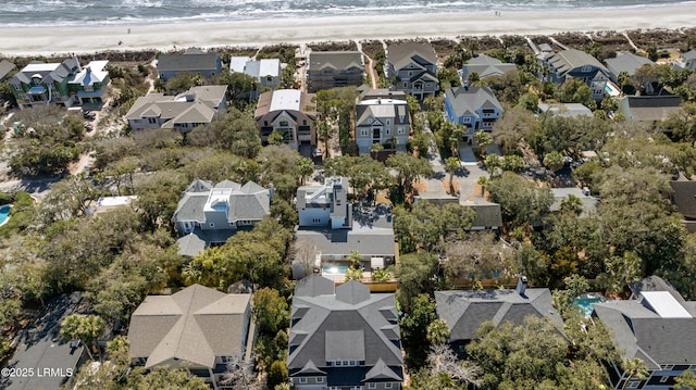 bird's eye view featuring a water view, a residential view, and a view of the beach