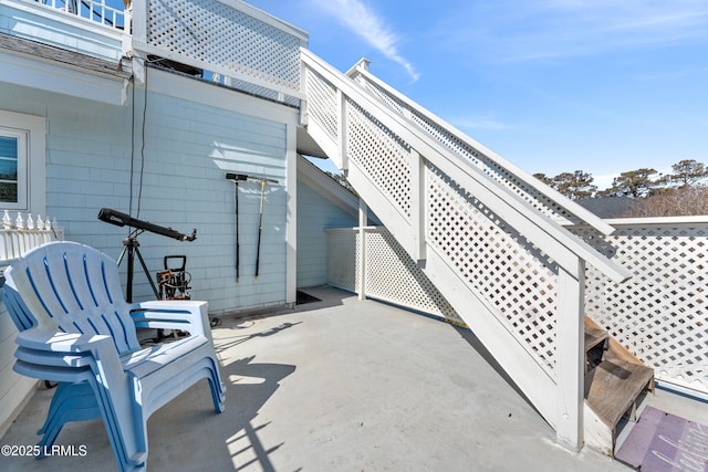 view of patio featuring stairway