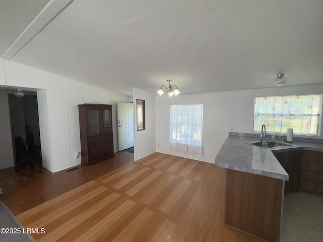 36 Clear Spring Rd, Saint Helena Island, SC 29920 - kitchen with a chandelier, plenty of natural light, and light wood-style flooring