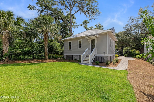 420 Waight St, Beaufort, SC 29902 - view of front of property with a chimney, a front lawn, and a metal roof