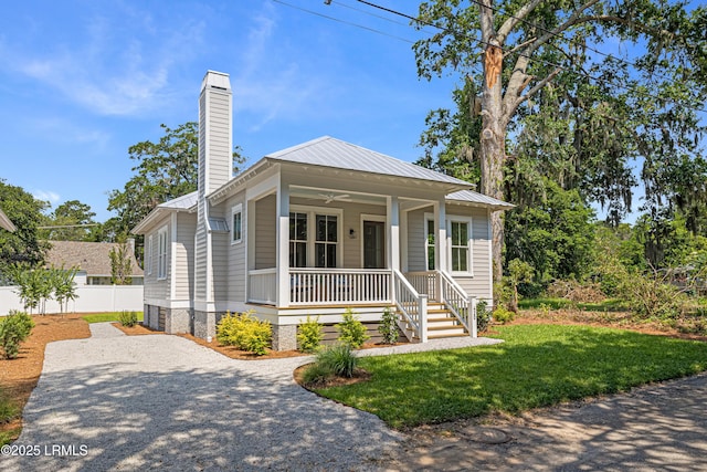 420 Waight St, Beaufort, SC 29902 - bungalow featuring a porch, a chimney, a metal roof, and driveway