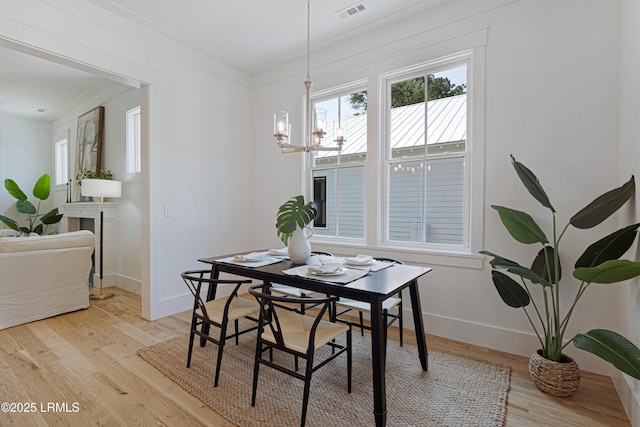 420 Waight St, Beaufort, SC 29902 - dining room with a chandelier, crown molding, and light wood-style floors