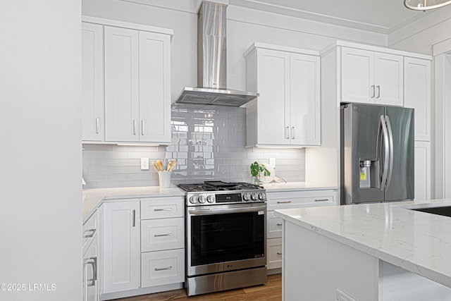 420 Waight St, Beaufort, SC 29902 - kitchen with appliances with stainless steel finishes, wall chimney range hood, white cabinets, backsplash, and light stone countertops