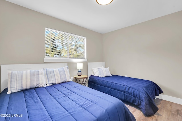 bedroom featuring wood-type flooring