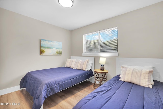 bedroom with wood-type flooring