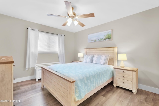 bedroom featuring ceiling fan and hardwood / wood-style floors