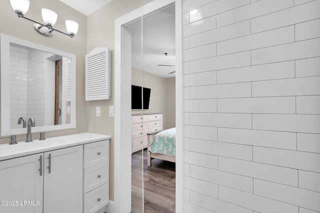 bathroom with vanity and hardwood / wood-style flooring