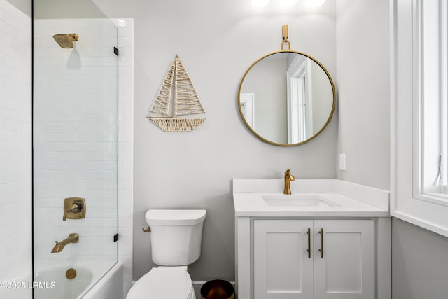 full bathroom with toilet, vanity, and  shower combination