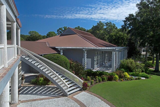 view of home's exterior featuring a lawn