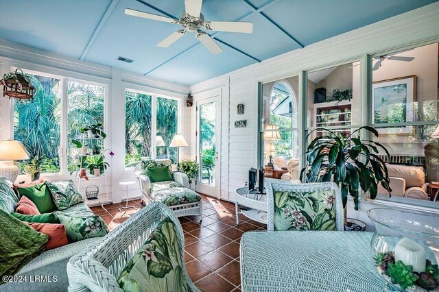 sunroom with vaulted ceiling and ceiling fan