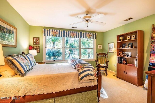 carpeted bedroom with ceiling fan