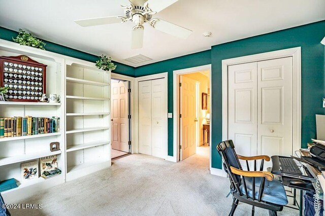 office featuring light colored carpet and ceiling fan