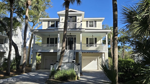 beach home with a garage and a porch