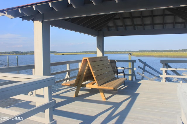 dock area with a gazebo and a water view