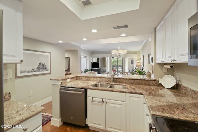 13 Harbourside Ln Unit 7155, Hilton Head Island, SC 29928 - kitchen with dishwasher, a chandelier, a peninsula, white cabinets, and light stone counters