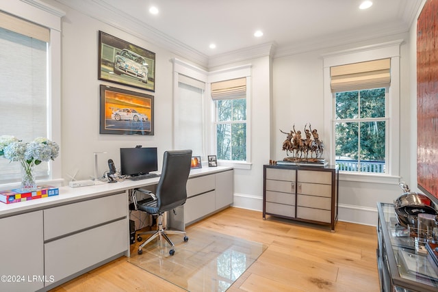 office space with ornamental molding and light wood-type flooring