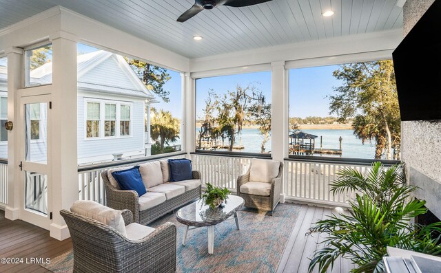 sunroom with wood ceiling and ceiling fan