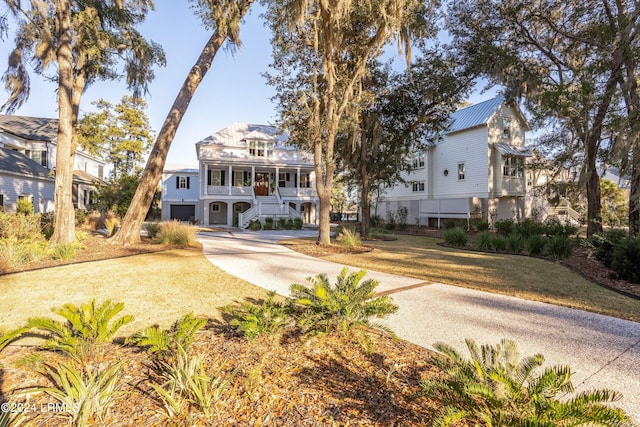 view of front of home with a front yard and a porch