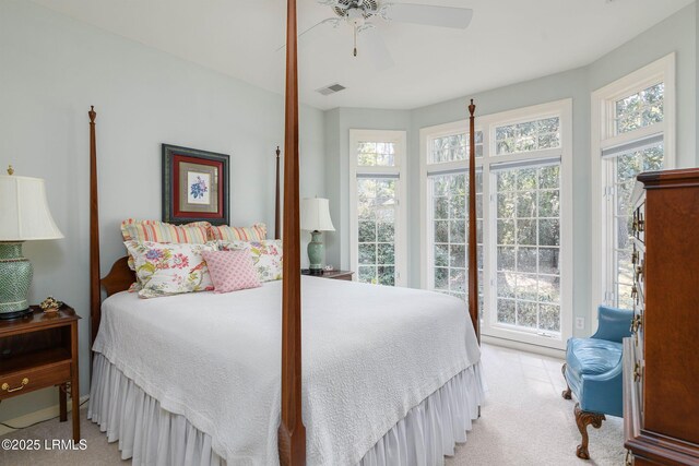 carpeted bedroom with access to exterior and ceiling fan