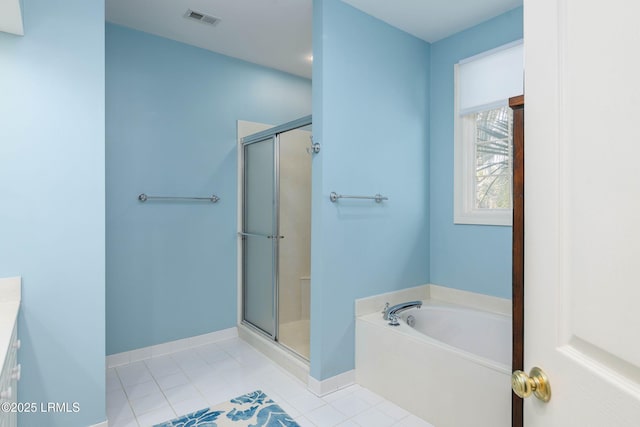 bathroom with tile patterned floors and plus walk in shower