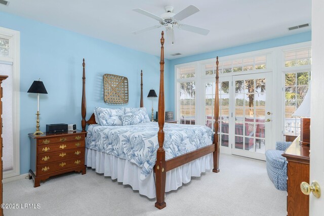 bedroom with access to outside, light colored carpet, french doors, and ceiling fan