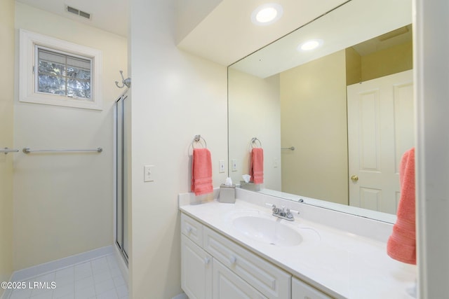 bathroom featuring vanity and walk in shower