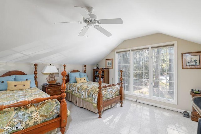 bedroom featuring light carpet, lofted ceiling, and ceiling fan