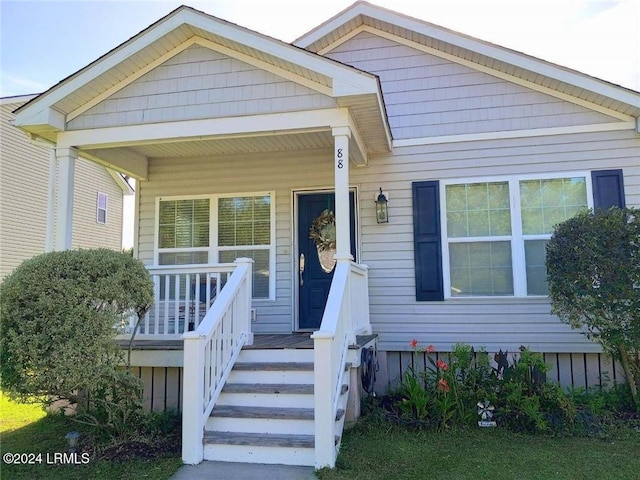 view of front of property featuring covered porch