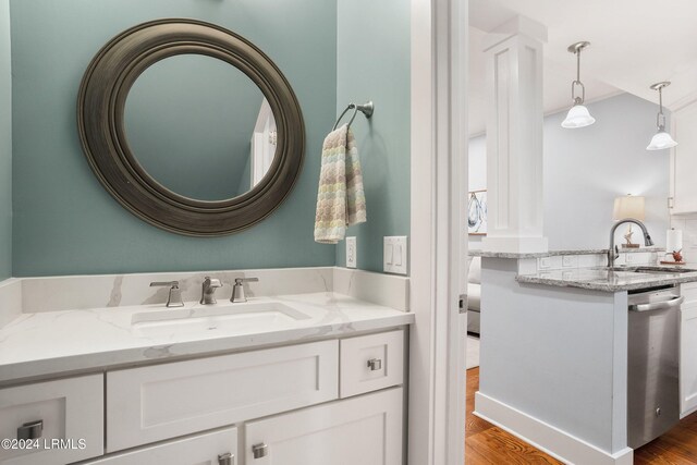 bathroom featuring hardwood / wood-style flooring and vanity