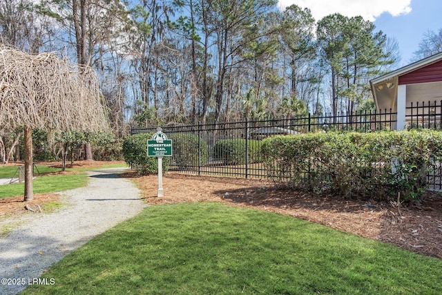 view of property's community with a lawn