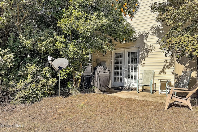 view of yard with french doors