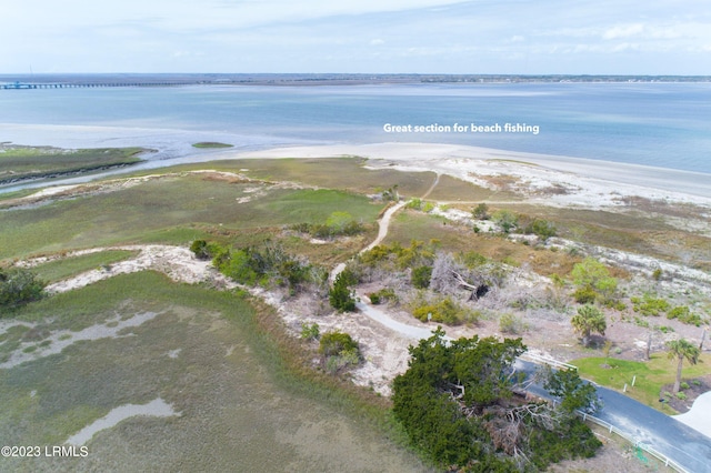 aerial view with a beach view and a water view