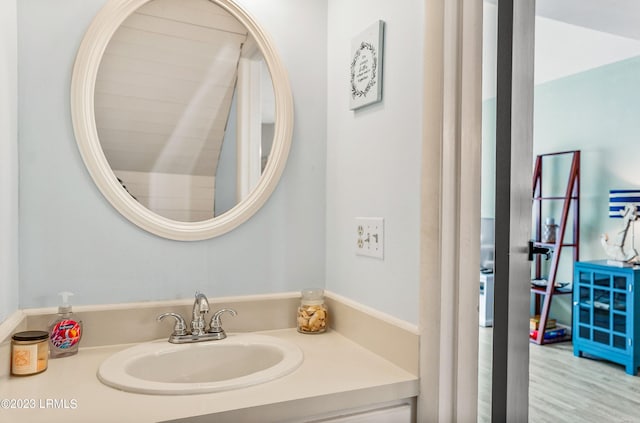 bathroom with vanity and hardwood / wood-style floors