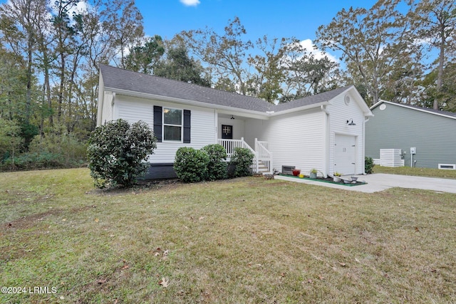 ranch-style house featuring a garage and a front lawn