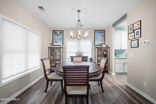 5 Regent Ave, Bluffton, SC 29910 - dining room with a chandelier and dark wood-type flooring