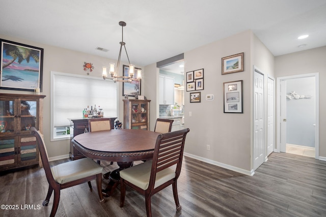 5 Regent Ave, Bluffton, SC 29910 - dining room featuring dark wood-style flooring, a chandelier, and recessed lighting