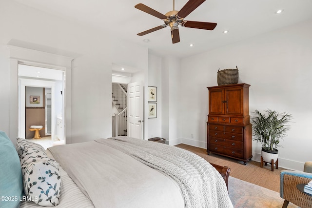 bedroom featuring a ceiling fan, recessed lighting, ensuite bath, and baseboards