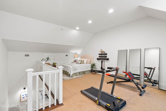 exercise area with lofted ceiling, visible vents, carpet flooring, and recessed lighting