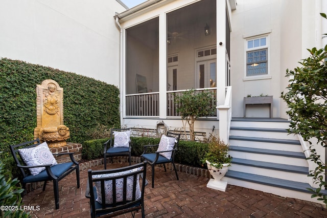 view of patio / terrace with a sunroom