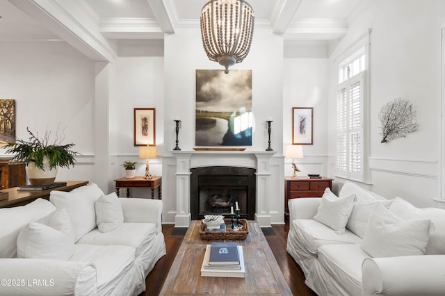 living area with crown molding, beam ceiling, a fireplace, and dark wood-style flooring