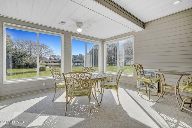 sunroom featuring beam ceiling, wood ceiling, visible vents, and ceiling fan