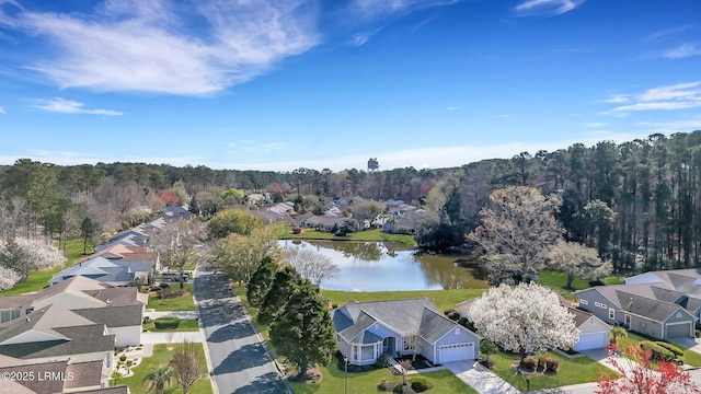 birds eye view of property featuring a residential view and a water view