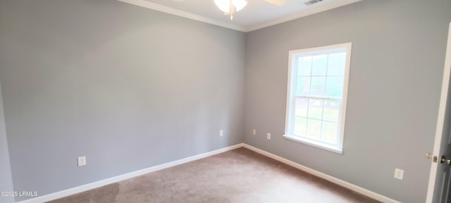 unfurnished room with carpet, visible vents, baseboards, ceiling fan, and ornamental molding