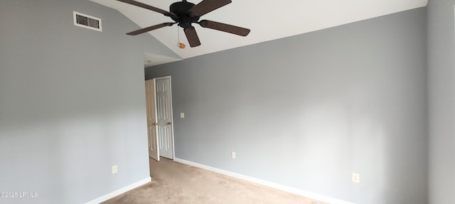 unfurnished room featuring a ceiling fan, baseboards, visible vents, carpet floors, and vaulted ceiling