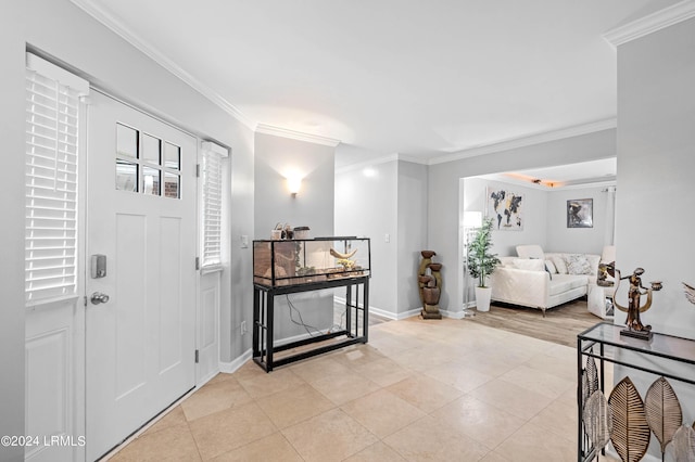 tiled foyer entrance with ornamental molding