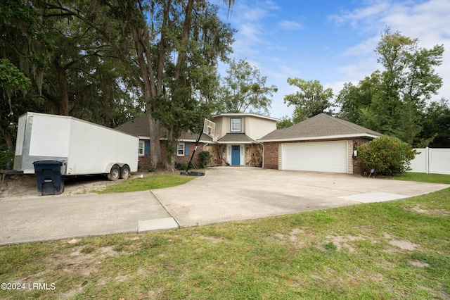 view of front of home featuring a garage and a front yard