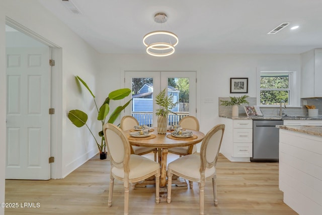 3001 N St, Beaufort, SC 29902 - dining area with light wood finished floors, healthy amount of natural light, and a chandelier