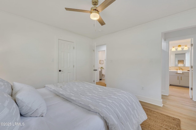 3001 N St, Beaufort, SC 29902 - bedroom featuring light wood-style flooring, ornamental molding, ceiling fan, ensuite bath, and baseboards