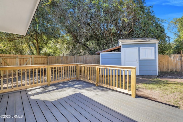 3001 N St, Beaufort, SC 29902 - wooden terrace featuring a storage unit, a fenced backyard, and an outbuilding