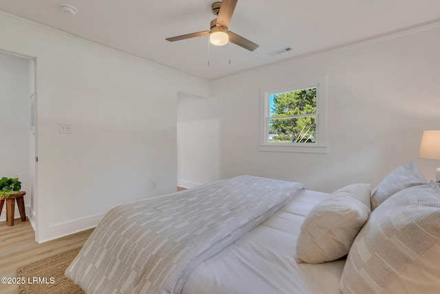 3001 N St, Beaufort, SC 29902 - bedroom featuring light wood-style floors, ornamental molding, baseboards, and a ceiling fan